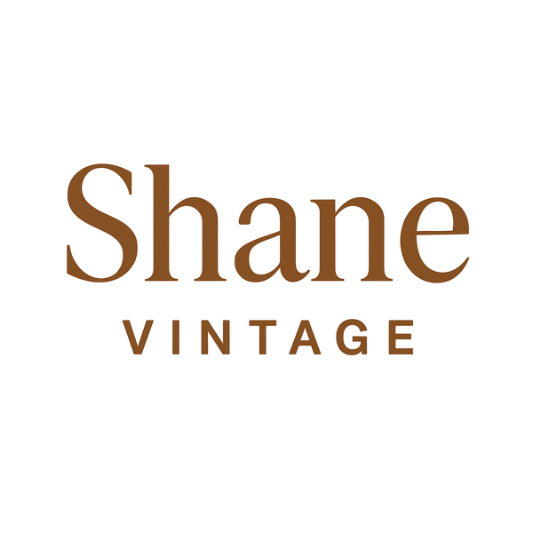 Shane Vintage logo on a beige background